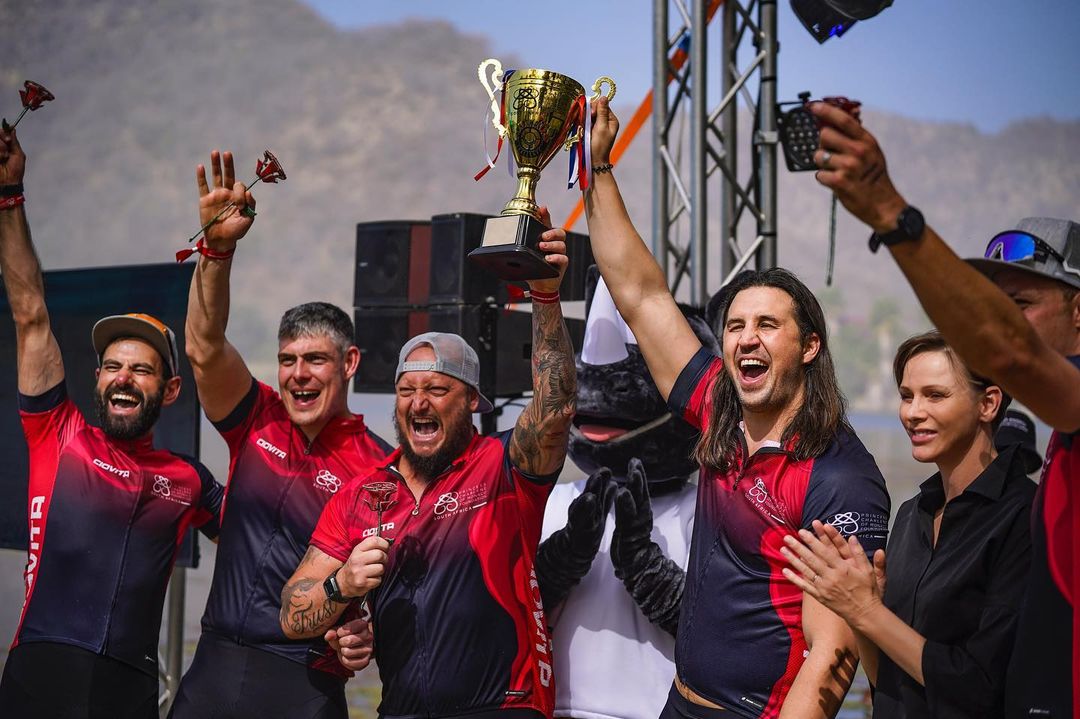 Sam Barton lifting the trophy with his teammates at Princess Charlene’s Water Bike Challenge.